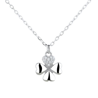 Silver necklace with a clover-shaped pendant on a white background