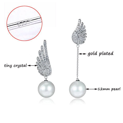 Pearl earrings with gold plating and crystals on a white background