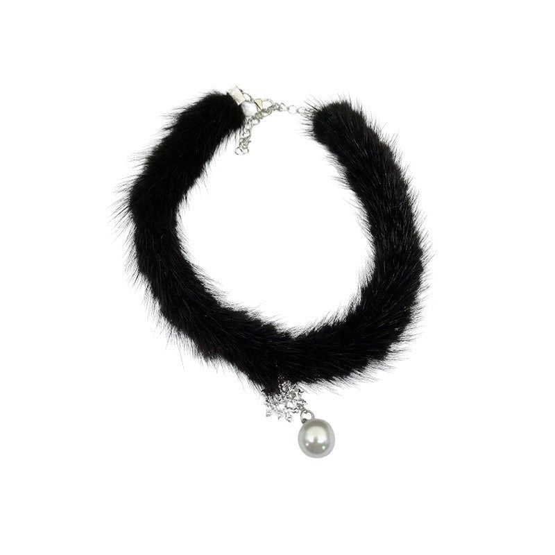 Black fur choker necklace with a pearl pendant on a white background