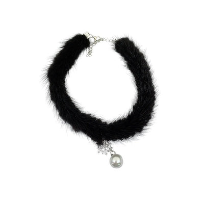 Black fur choker necklace with a pearl pendant on a white background