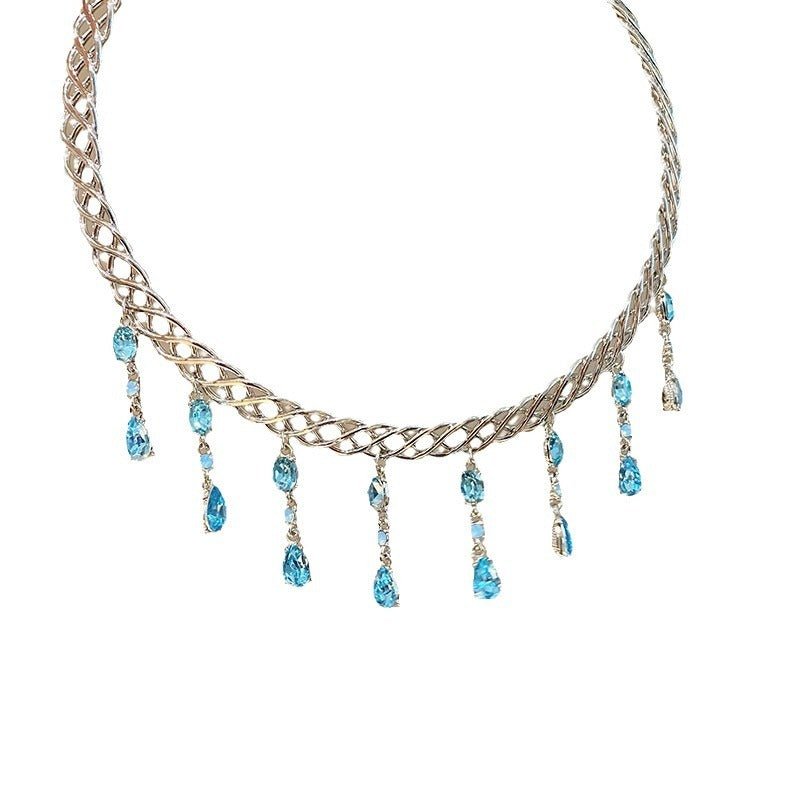 Necklace with braided design and blue teardrop beads on a white background