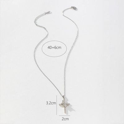 Silver necklace with a cross pendant on a white background
