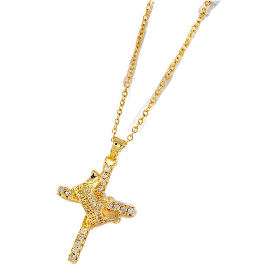 Gold cross necklace with clear stones on a white background
