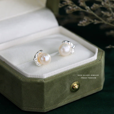 Pearl earrings in a green jewelry box with '925 Silver Jewelry' branding.