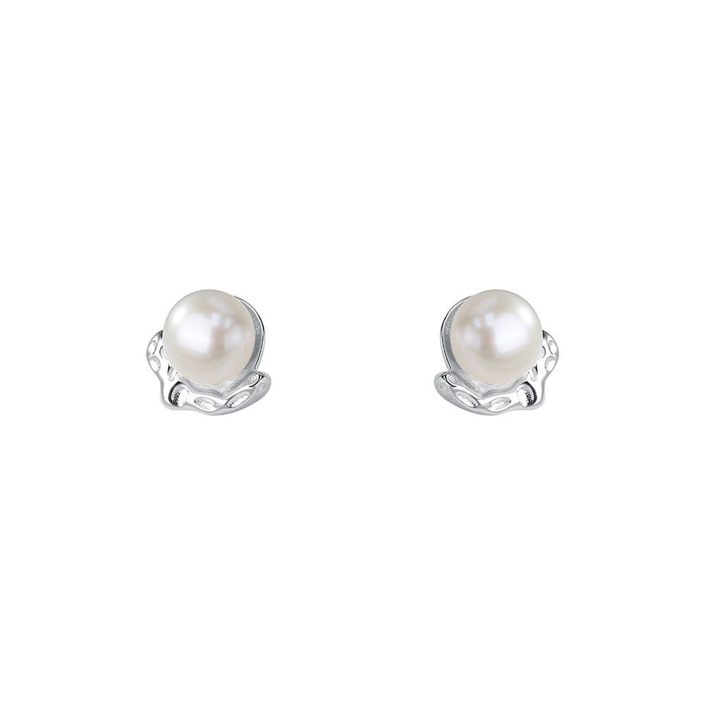 Pair of pearl stud earrings on a white background