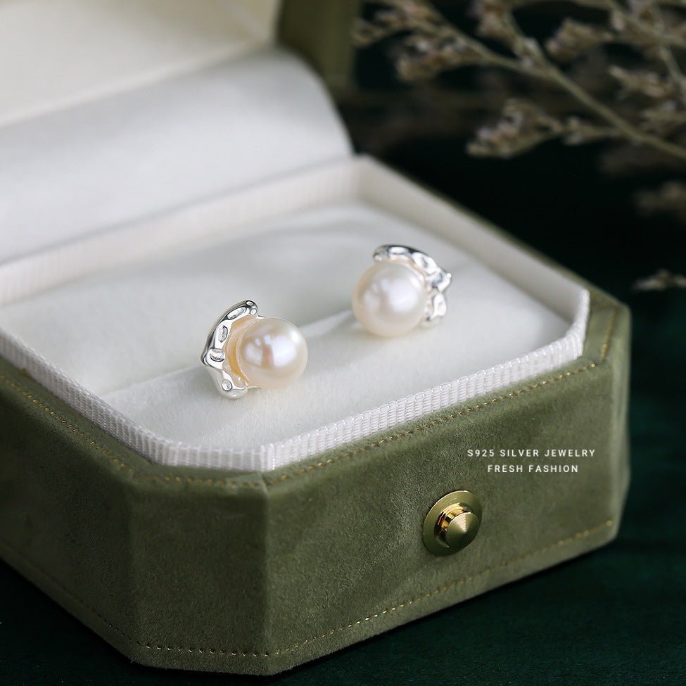 Pearl earrings in a green jewelry box with '925 Silver Jewelry' branding.
