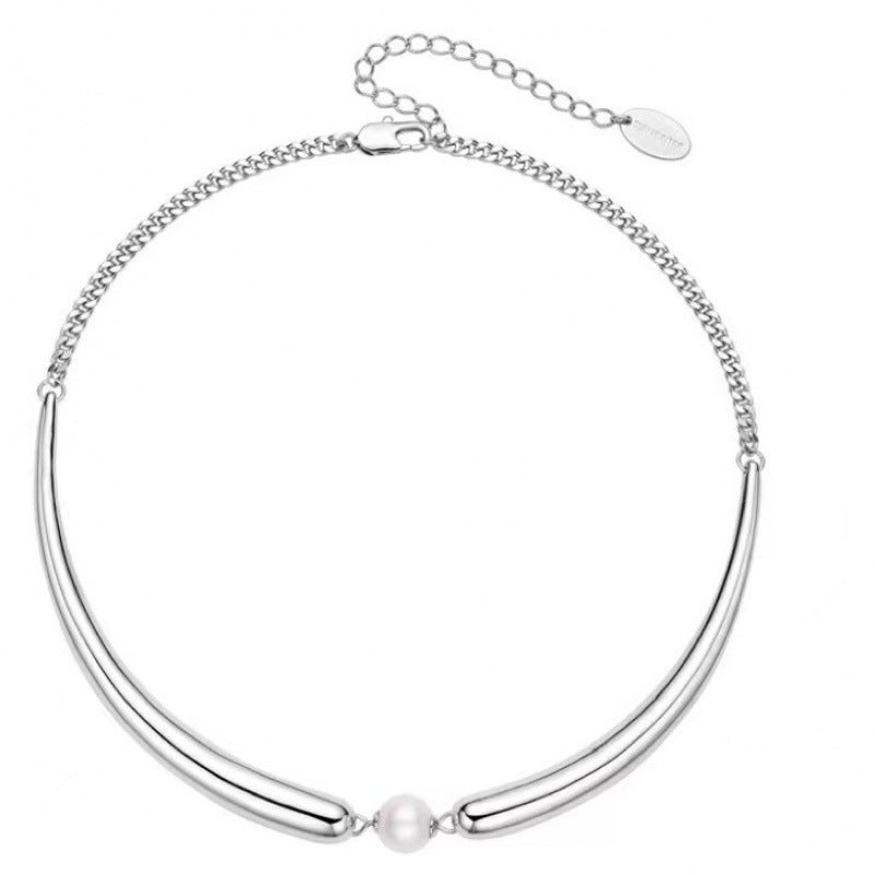 Silver necklace with a pearl pendant on a white background